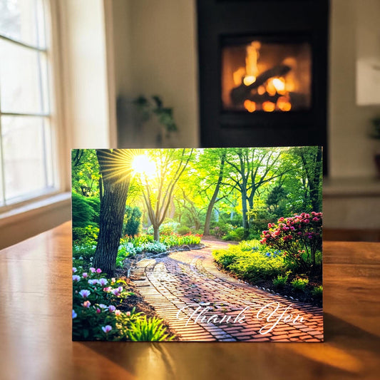 Nature-themed wall art with a garden path and 'Thank You' text in a room with a fireplace.